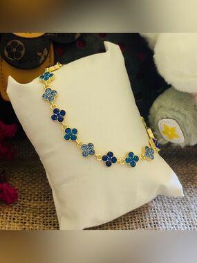 Gold-Tone Floral Bracelet with Blue Crystal Flowers